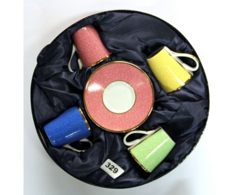A cased Royal Worcester harlequin coffee set.