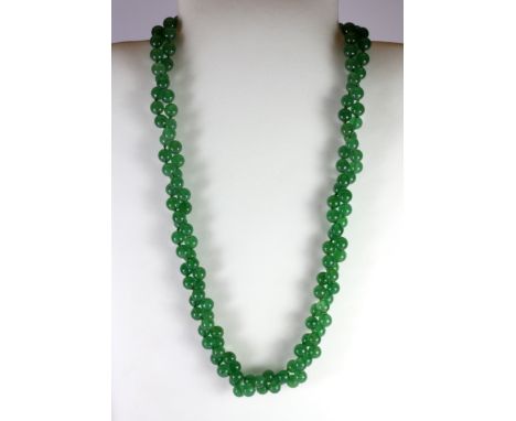 A double row polished jade necklace.
