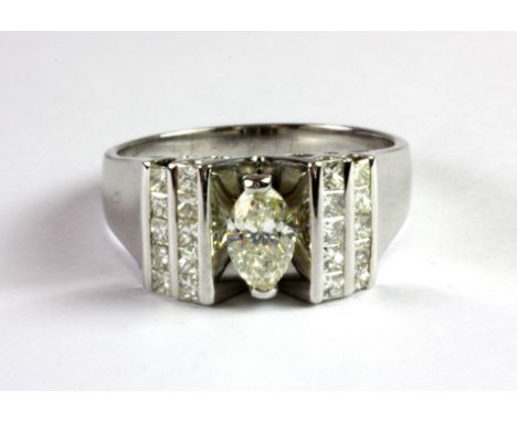 A 14ct white gold (stamped 545) ring set with a marquise cut centre diamond and diamond set shoulders (R).