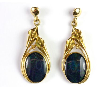 A pair of yellow metal (tested 18ct gold) black opal set drop earrings, L. 4.5cm.