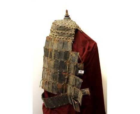 A rare Tibetan painted tin and leather partial suit of armour with helmet, neck and shoulder protection, each pair of panels 