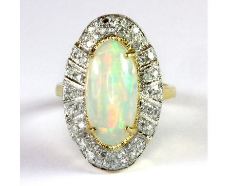 An Art Deco style 18ct yellow gold (stamped 750) ring set with a cabochon cut opal surrounded by diamonds (O).