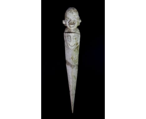 A Tibetan carved jade purba, L. 22cm.