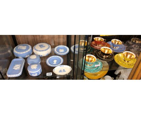 PIGEONHOLE OF WEDGWOOD BLUE JASERWARES, PIN DISHES, TRINKET BOXES AND A SIX PIECE MULTI COLOURED TEACUPS AND SAUCERS