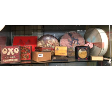 SHELF OF VINTAGE ENAMEL ADVERTISING TINS