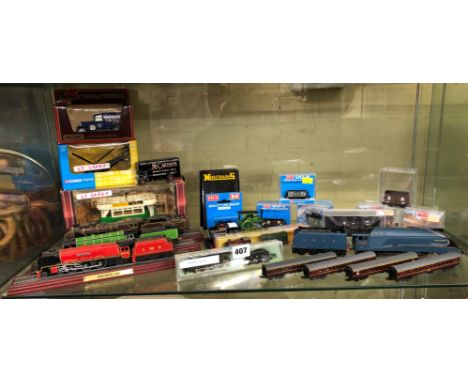 SHELF OF BOXED DIECAST MODELS AND PECO NARROW GAUGE TRAIN ROLLING STOCK MODELS AND LOCOMOTIVES