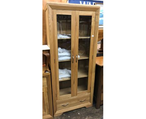 CONTEMPORARY LIGHT OAK GLAZED DOOR TALL CABINET WITH FITTED DRAWER
