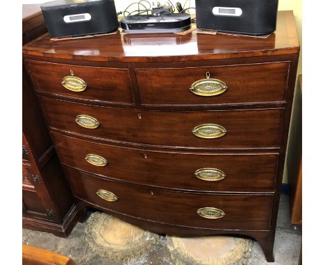 GEORGE III MAHOGANY CROSS BANDED BOW FRONTED TWO OVER THREE DRAWER ON SLAY BRACKET FEET 