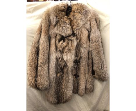CALMAN LINKS, LONDON FUR COAT WITH LEATHER PANELS AND TOGGLE BUTTON DETAIL
