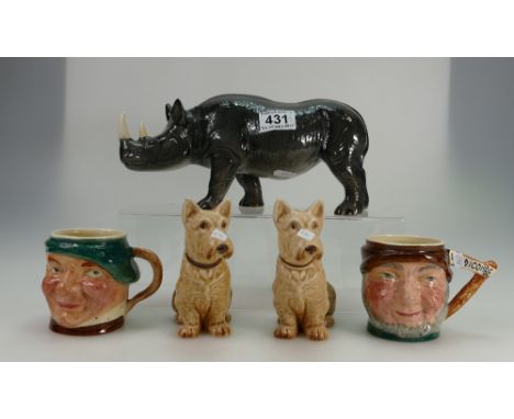 A collection of items to include Sylvac dogs x 2, Lancaster Sandland Character jugs, x 2 and Melba Ware Rhino (5)