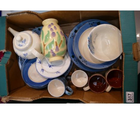 A mixed collection of Poole pottery dinnerware in predominantly blue colouration to include dinner plates, side plates, bowls