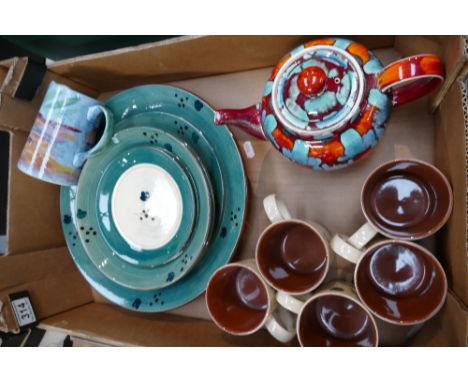A collection of Poole Pottery dinnerware in the dark green colouration to include bowls, plates, side plates, mugs, together 
