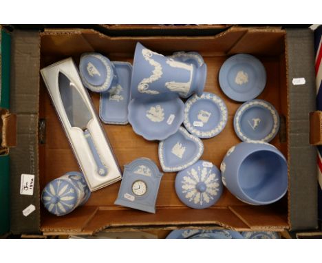 A mixed collection of Wedgwood jasperware items to include small mantle clock, boxed cake slice, trinket boxes, ginger jar, l