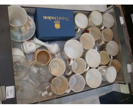 A mixed collection of ceramic items to include commemorative cups and mugs and anniversary champagne glasses