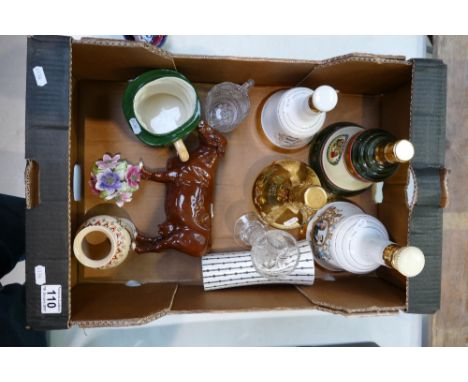 A mixed collection of items to include ceramic whiskey flagon's, unmarked figure of a cow, Staffordshire Toby jug of Mr Pickw
