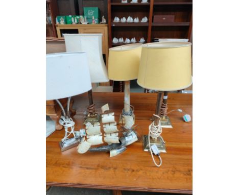 Lot of various vintage Corinthian column table lamps together with horn boat lamp. 