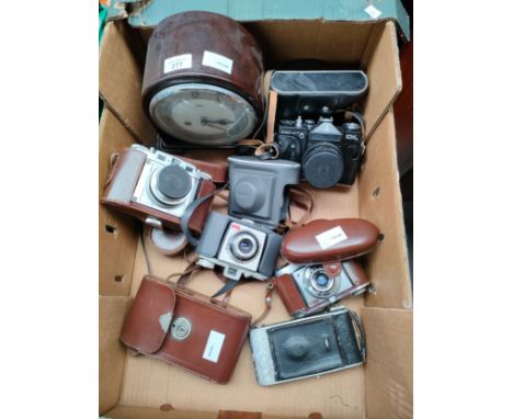 Box of vintage cameras includes zenit and Braun Nurnberg camera together with Bakelite Smiths mantle clock. 