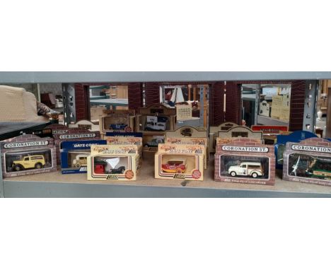 Large shelf of Lledo models includes coronation street series models etc . 