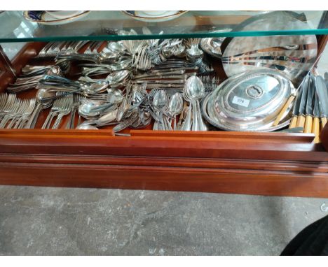 Large shelf of silver plated cutlery, tureen dishes etc 