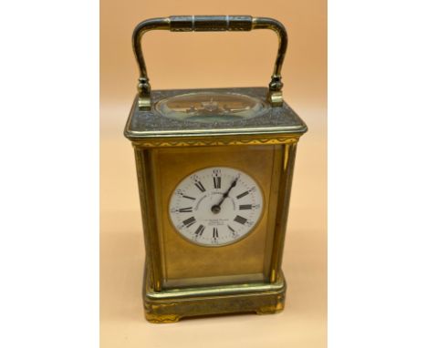 Antique French brass and bevel glass carriage clock, Double drum movement, body engraved with design. Movement by Goldsmith &