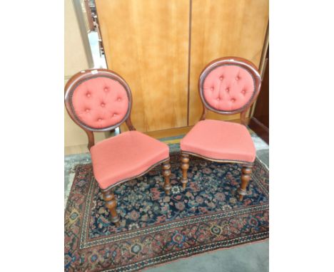 Pair of Victorian button back chairs. Supported on turned legs. [One has signs of old wood worm] 