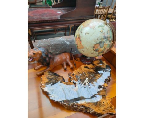 Interior globe , rustic style clock together with lion figure. 