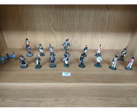 Shelf of various lead soldiers. 