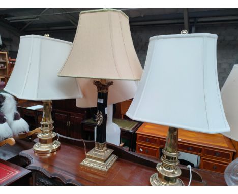 Antique Gilt and Black Stepped Corinthian / Nelson Column Brass Oil Lamp Base together with pair of brass interior lamps. 