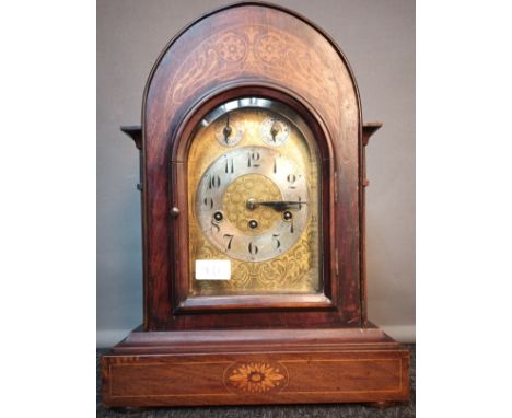 19th century bracket clock, case detailed with marquetry inlays. Movement by Junghans, comes with key and pendulum. In a work