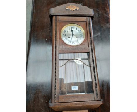 Oak cased wall clock. 