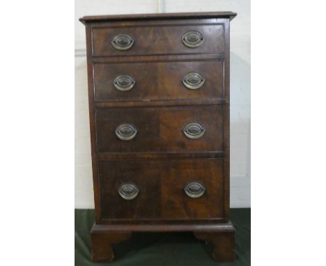 A Mid 20th Century Walnut Narrow Chest of Four Graduated Long Drawers on Bracket Feet, 55cm Wide 