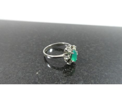 A French Dress Ring with Green and White Stones 