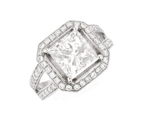 5.54 Carat TW Diamond and 14 Karat White Gold Engagement Ring. Set in the center with a 4.04 carat princess cut diamond, G co