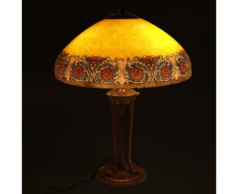 Early 20th Century Handel Reverse Painted Lamp. The glass shade of dark yellow ground with wide floral border. Sits atop Hand