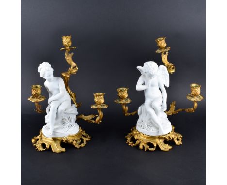 Pair 19th Century Sevres Bisque and Gilt Bronze Figural Candelabra. Each with 3 lights. Impressed Sevres mark. Measures 13-1/