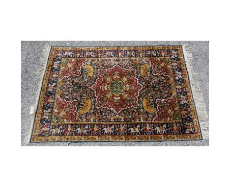 Semi Antique Persian Wool Rug. Hunting scene with figures on horseback and animals. Measures 24-1/2" x 49-1/2". Condition: We