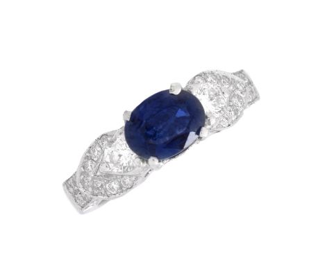 Approx. 1.20 Carat Oval Cut Sapphire, 2.10 Carat TW Round Brilliant Cut Diamond and 18 Karat White Gold Ring. Stamped 18K. Ri