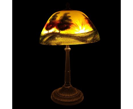 Early 20th Century Handel Style Reverse Painted Lamp. Shade features a landscape of trees both reverse painted and enameled o