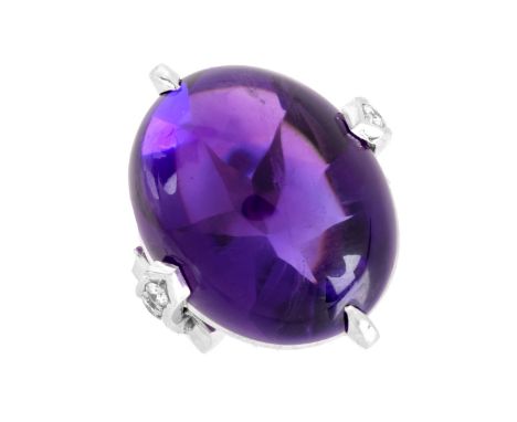 Vintage Christian Dior Large Cabochon Amethyst, .21 Carat Round Brilliant Cut Diamond and Platinum Ring. Amethyst measures 21