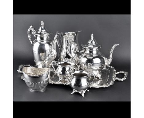 Seven (7) Pieces Silver Plate Holloware. Includes: rectangular tray, ribbed bowl, coffee pot, water pitcher, tea pot, creamer