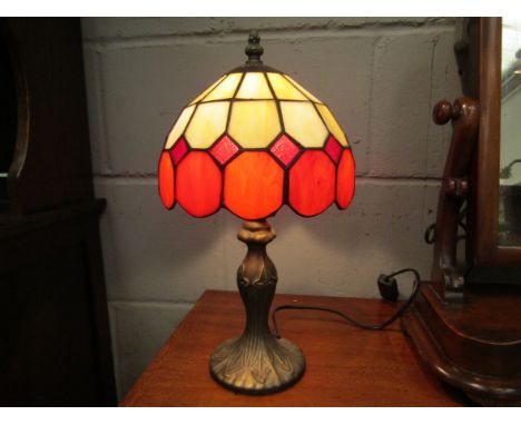 A Tiffany style table lamp base with red and cream glass 