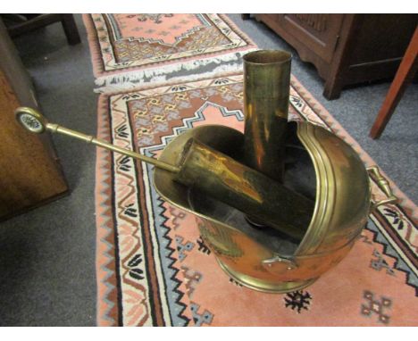 A pair of "Trench Art" brass shell cases with allover design, a brass coal scuttle (a/f) and fire tools