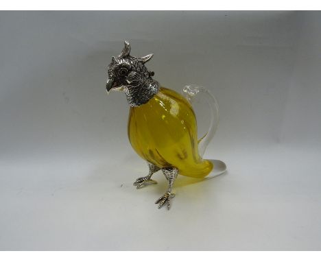 A small amber glass and silver plated cock claret decanter, 16.5cm high