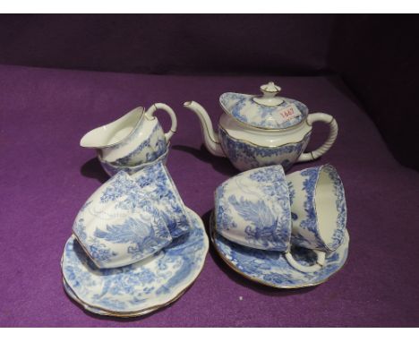 A part tea service by Royal Crown Derby with blue and white pheasant design