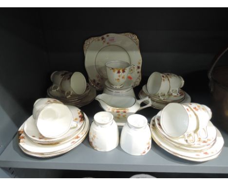 A part tea service by Tuscan China in the plat design