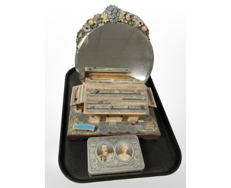 A Barbola mirror, together with a silver jubilee 1935 tin and a musical trinket box in the form of a cottage.