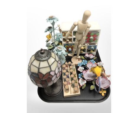 A small Tiffany style leaded glass table lamp, several small glass vials containing coloured beads, wrought metal scones, woo