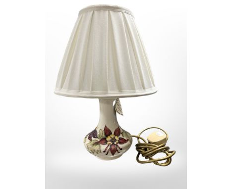 A Moorcroft pottery table lamp with shade, height 37 cm. 