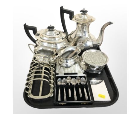 A silver plated four piece tea service, rose bowl, bottle coaster, set of six teaspoons, seven bar toast rack etc 