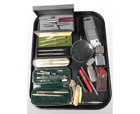 Boxed pens including Parker, Cross and several pockets knives, lighters, Swiss Army knife, magnifying glass, night vision dra
